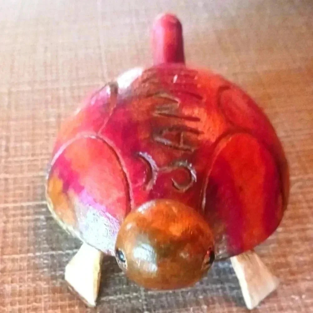 A beautiful Jamaican Turtle made from wood. About 4 and a half inches.